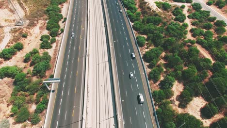 Tilt-down-aerial-on-cars-traveling-on-highways