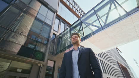 business owner standing street under sunlight. young leader posing near office