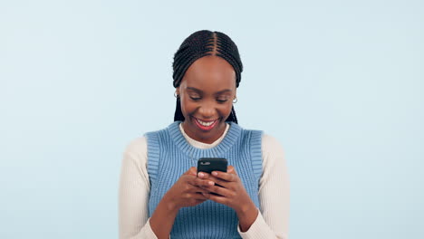 Woman,-smile-and-typing-on-smartphone-in-studio