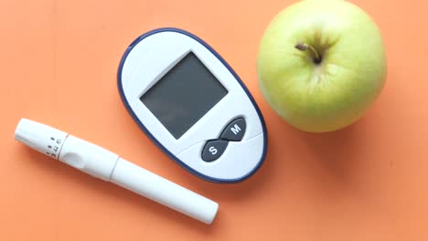 glucose meter and apple