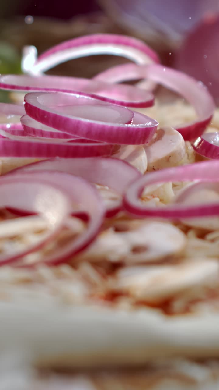 Pizza topping with red onions and mushrooms