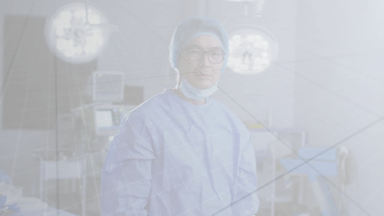 Male doctor in clinic observing charts while red pandemic graphics projecting and revealing face