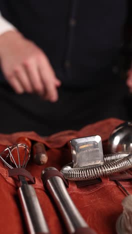 bartender preparing cocktails with a set of tools