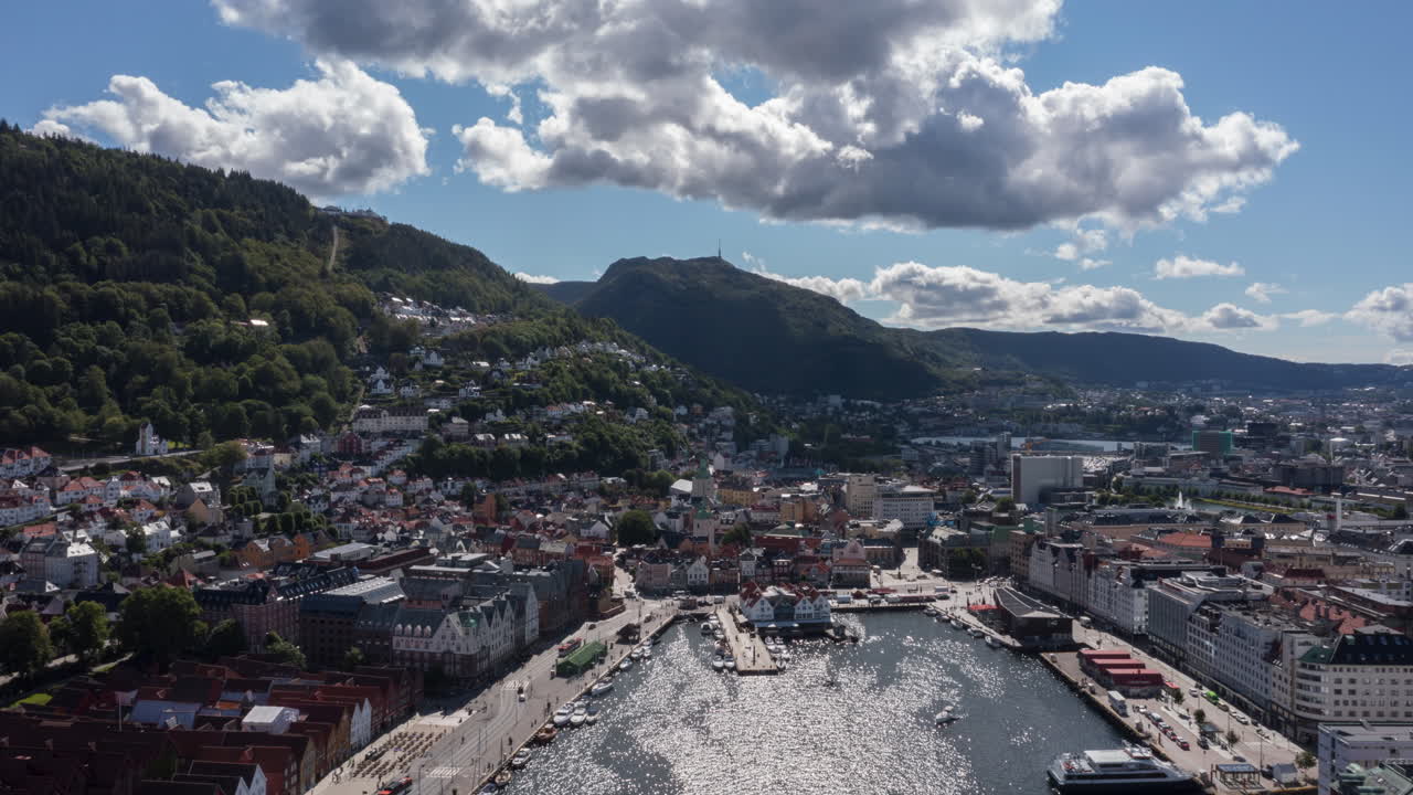 Aerial hyperlapse of downtown Bergen, Norway, showing the famous Bryggen and Fish Market on a beautiful summer day.