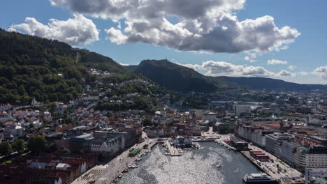aerial hyperlapse of downtown bergen, norway, showing the famous bryggen and fish market on a beautiful summer day.