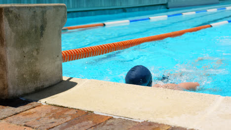 male swimmer looking outside the pool 4k