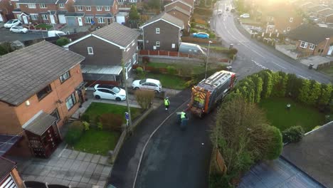 january 201, aerial view, footage of dustmen putting recycling waste into a garbage truck, bin men, refuse collectors