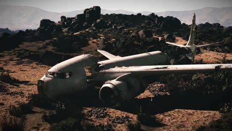 abandoned airplane wreck in a desert landscape