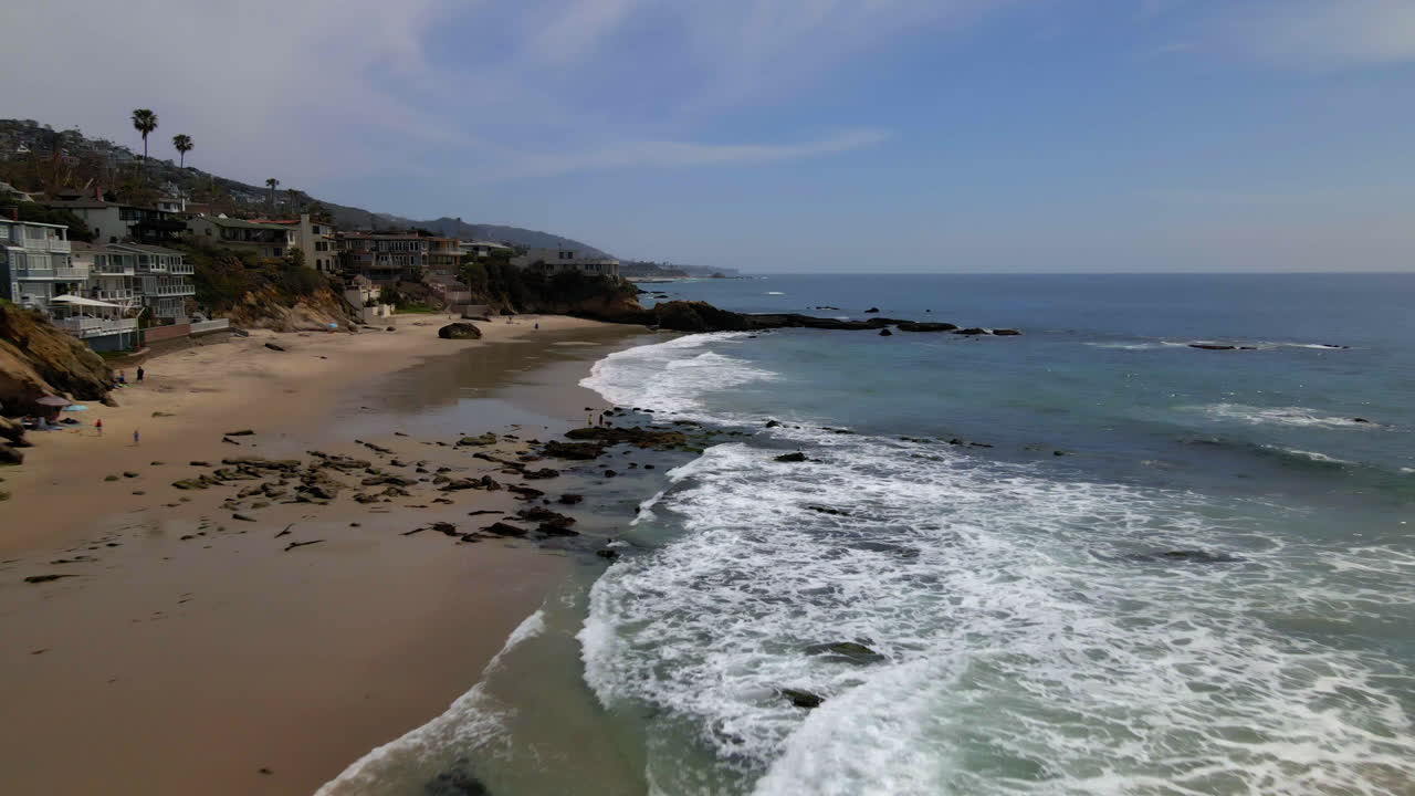 Scenic Aerial View of Laguna Beach Coastline with Waves and Houses
