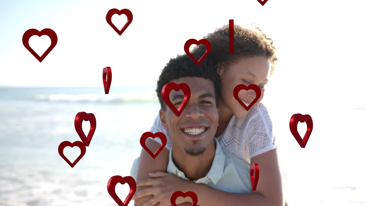 Animation of hearts moving over diverse couple in love on beach in summer