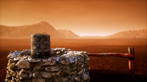 old stone water well in the desert