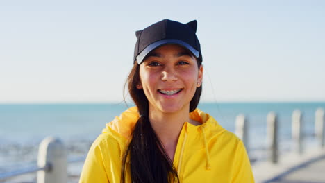 teenager, happy and face of a girl at the beach