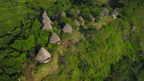 Bungalow-cozy-rooms-structure-between-bamboo-plants-in-green-valley