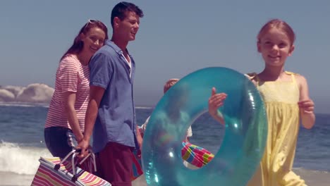 Happy-family-posing-with-buoys