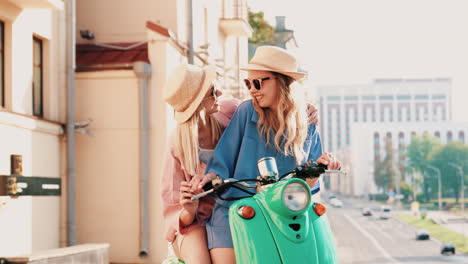 two friends enjoying a ride on a scooter in the city