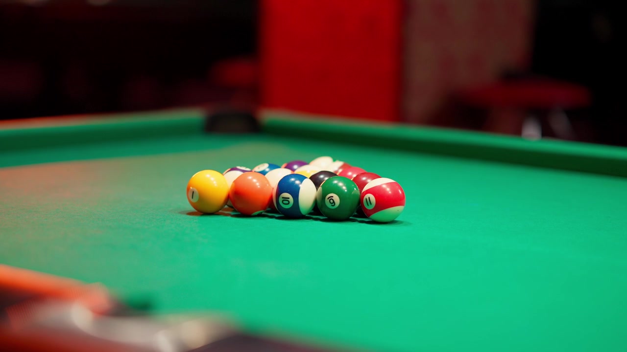 Slow Motion Shot of Billiard Balls Breaking on a Green Pool Table