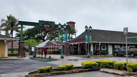 coconut marketplace entrance in kauai hawaii, quaint open-air shopping village with stores, restaurants, coffeeshops and local art. coconut marketplace at kapaa on the island of kauai in hawaii