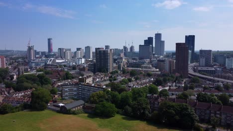drone shot flying backwards from croydon city with modern skyscrapers