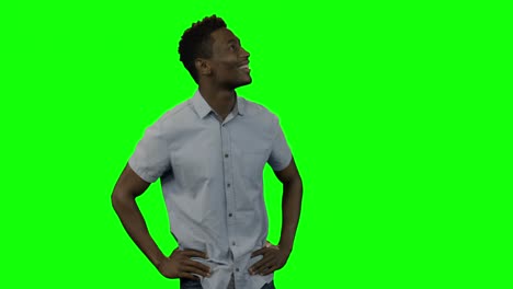Man-looking-around-against-green-screen