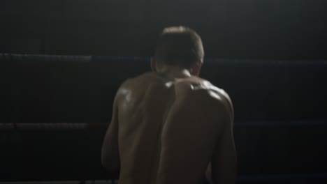 man preparing in boxing ring