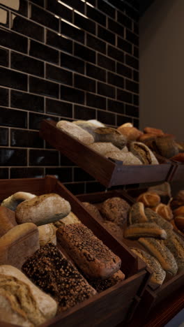 various types of breads on display at a bakery