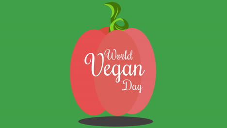 animación de la ilustración del texto del día mundial vegano en blanco sobre una manzana roja, sobre un fondo verde