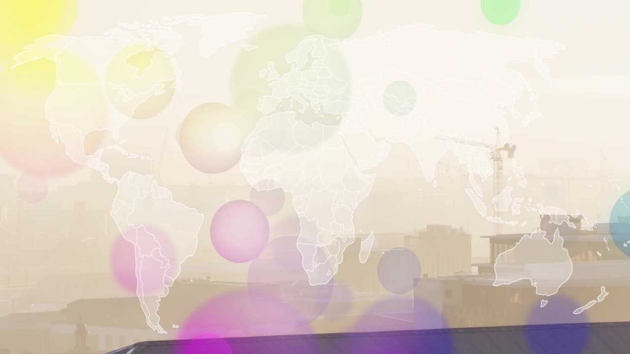 Colorful circles overlaying world map and urban skyline with animation of cranes