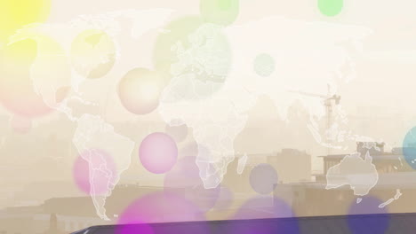 colorful circles overlaying world map and urban skyline with animation of cranes