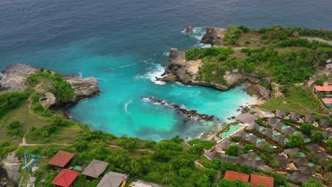 extremely turquoise tropical water at blue lagoon at nusa ceningan island, aerial