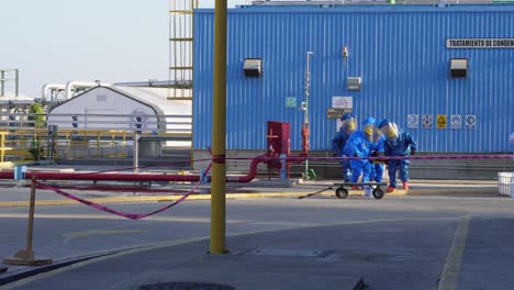 people with hazmat perform rescue in a chemical emergency