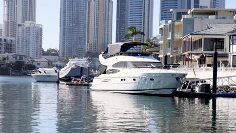 a yacht docked near waterfront buildings