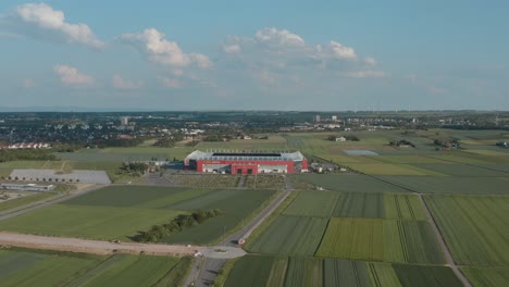 drone - aerial shot of the football stadium of the bundesliga team fsv mainz 05 with field in the foreground on a sunny day, 25p