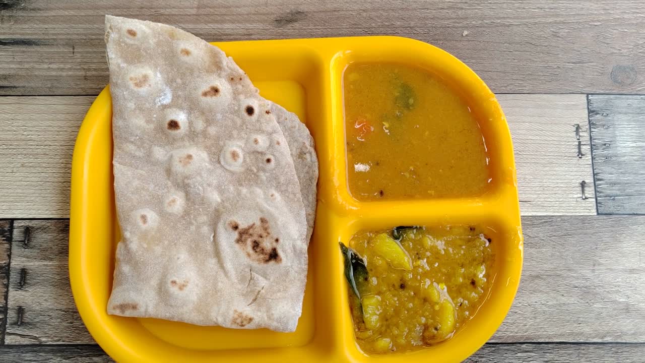 Capati, served with two delicious gravies, makes for a perfect breakfast. This traditional flatbread offers a satisfying and flavorful start to your day.