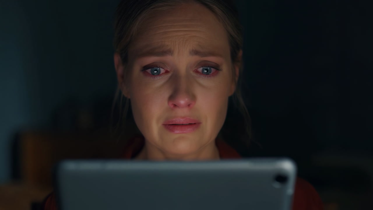 White Woman Crying Over Tablet Latenight Closeup Of Tearful White Woman Illuminated By Tablet Glow, Reacting