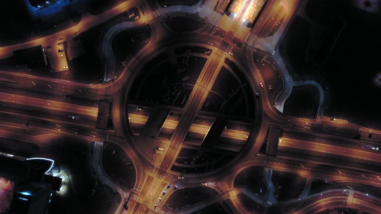 Aerial of Roundabout Junction Traffic at Night