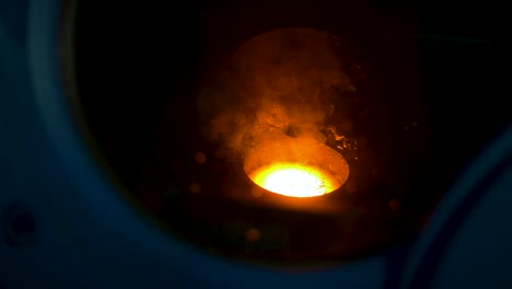 glowing hot fused metal in a plasma arc furnace