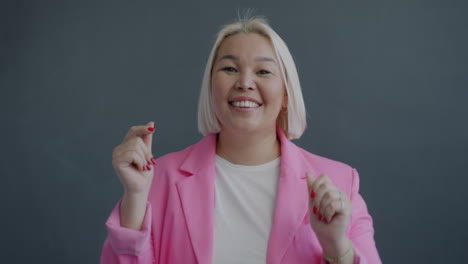 woman in pink blazer