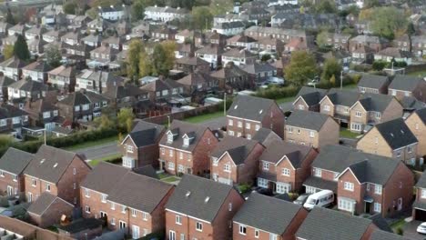 property ladder new british housing estate aerial view overlooking rooftops closeup left dolly