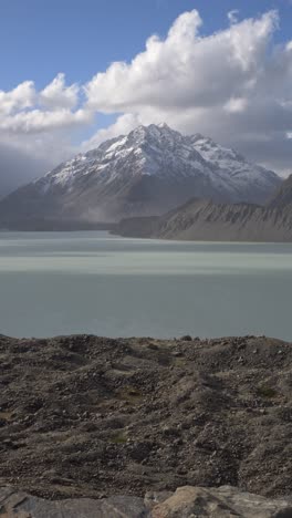 tasman glacier lake at mount cook national park in south island, new zealand - vertical shot