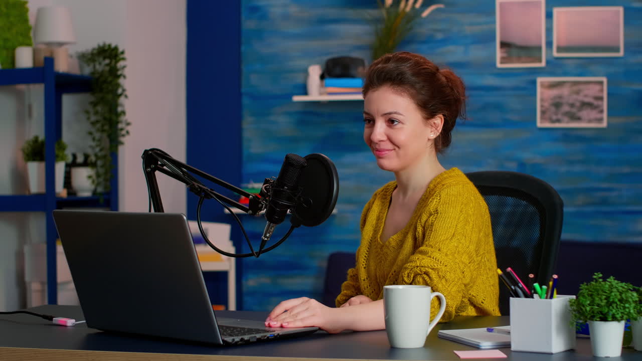 Portrait of caucasian vlogger working in cozy studio