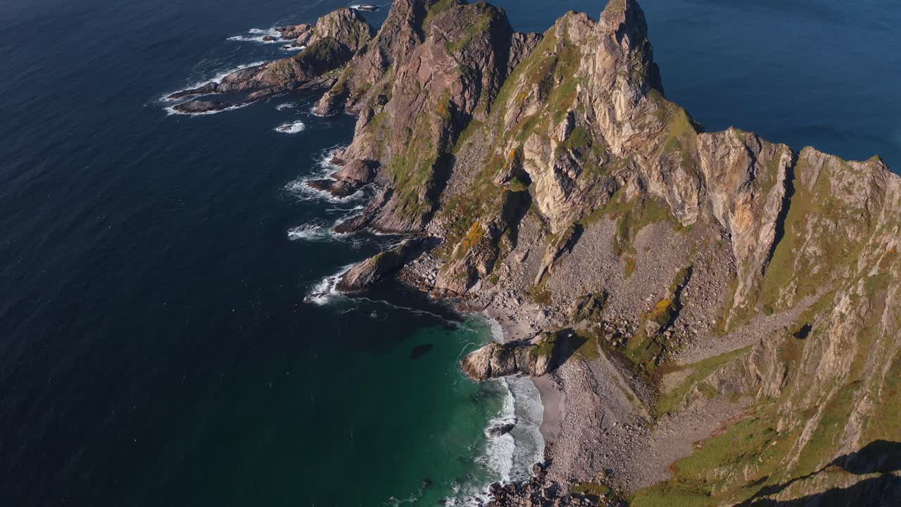 Måtinden mountain overlooking a beautiful coastline, showing steep cliffs and ocean view