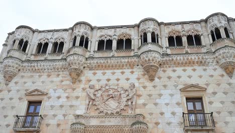 the infantado palace showcases stunning renaissance architecture in guadalajara, spain. its iconic diamond facade and ornate details embody spanish history and cultural grandeur