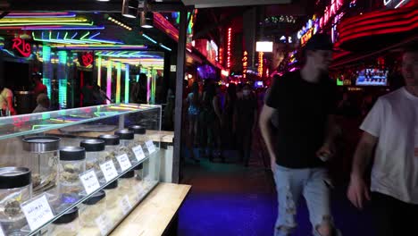 people walking through a vibrant night market