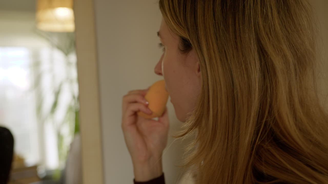 Girl doing makeup at home