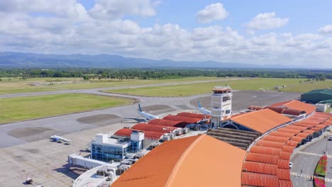 aerial drone shot of cibao international airport, also known as santiago airport, in santiago de los caballeros dominican republic