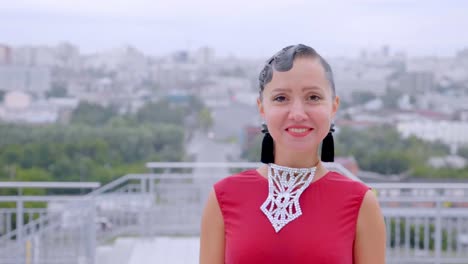 woman in ballroom dress posing in city
