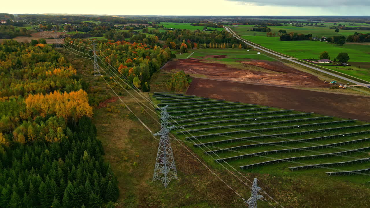 Power electricity grid high voltage cable, field multicolor forest autumn fall