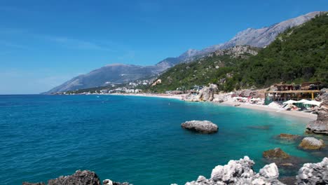 secretly hidden beach paradise: unspoiled white pebbles, turquoise waters, and cliffs in albania for a perfect summer vacation