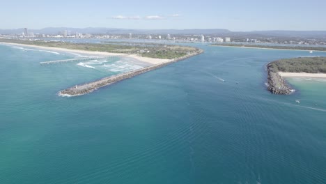 sand bypass pumping jetty and the spit in south stradbroke island - coral sea in gold coast, qld, australia