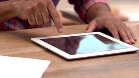 Casual-business-man-using-his-tablet